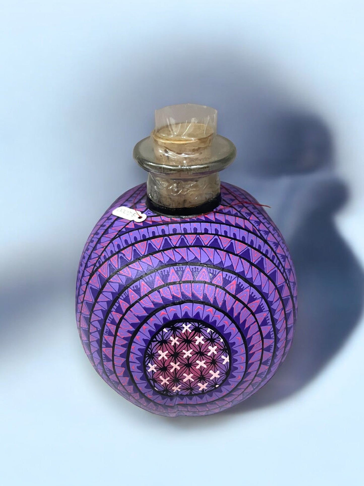 Calavera Alebrije con Botella de Vidrio con mezcal