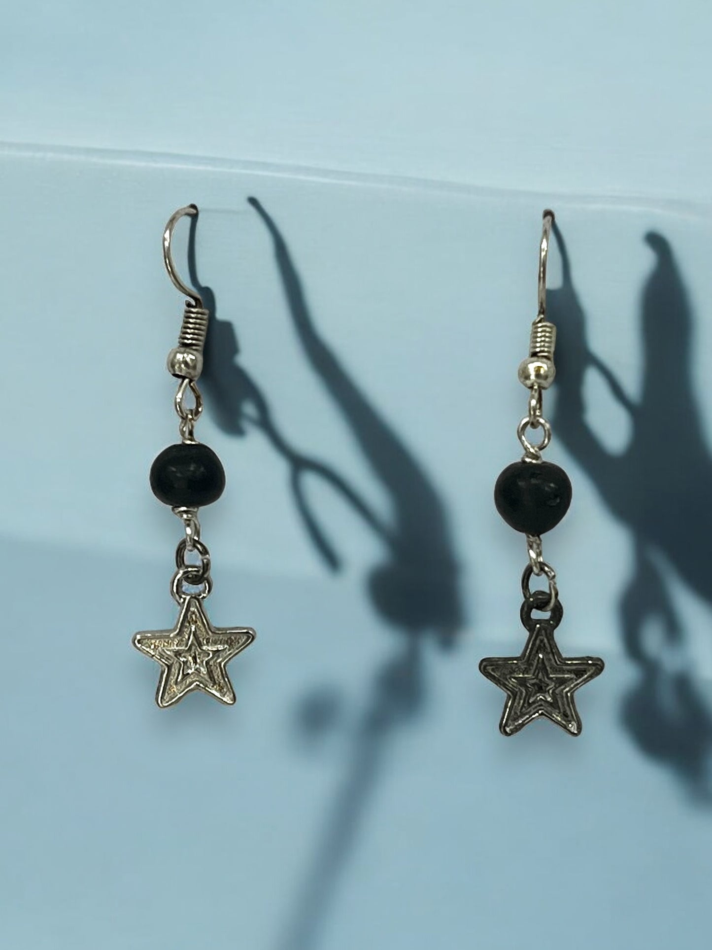 Aretes Colgantes con Estrella Plateada